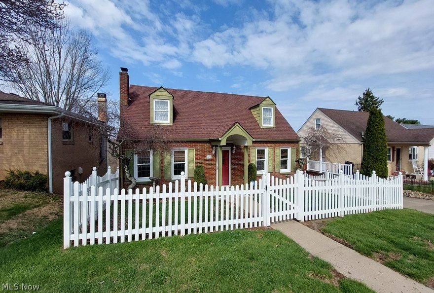 This charming 1½-story brick Cape Cod home offers the perfect blend of classic character and functional living space. Featuring 4 bedrooms and 2 full bathrooms, with one bath conveniently located on each floor, the layout provides flexibility for a variety of lifestyles. The home includes a 90% finished basement complete with a full second kitchen and a spacious rec room, making it ideal for entertaining, extended living, or guest accommodations. Laundry is currently located in the basement, with additional hookups available in the front bedroom or office on the main floor for added convenience. Enjoy outdoor living with a rear screened-in porch that overlooks a large deck, perfect for relaxing or hosting gatherings. For added peace of mind, the home is equipped with a natural gas generator capable of powering the entire house during outages. This well-maintained home offers space, versatility, and timeless appeal—ready for its next owner to move in and make it their own.