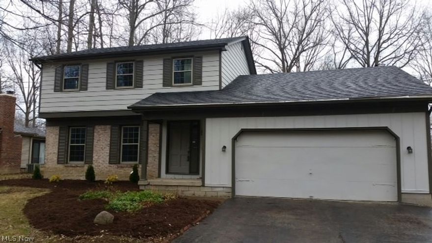 Two story, three bedroom home directly accoss from beautiful Mill Creek Park.   Totally ready to move in. Entire house has been freshly painted in neutral colors. All new carpet and flooring throughout.  New:  windows, furnace, air conditioning, flooring, lighting, hot water tank, sump pump. Kitchen with granite counter top, all new stainless steel appliances.  Bathrooms have remodeld- one full, two half.  Family room with fireplace.  Basement has been waterproofed. Once you see it, you will want to move in!