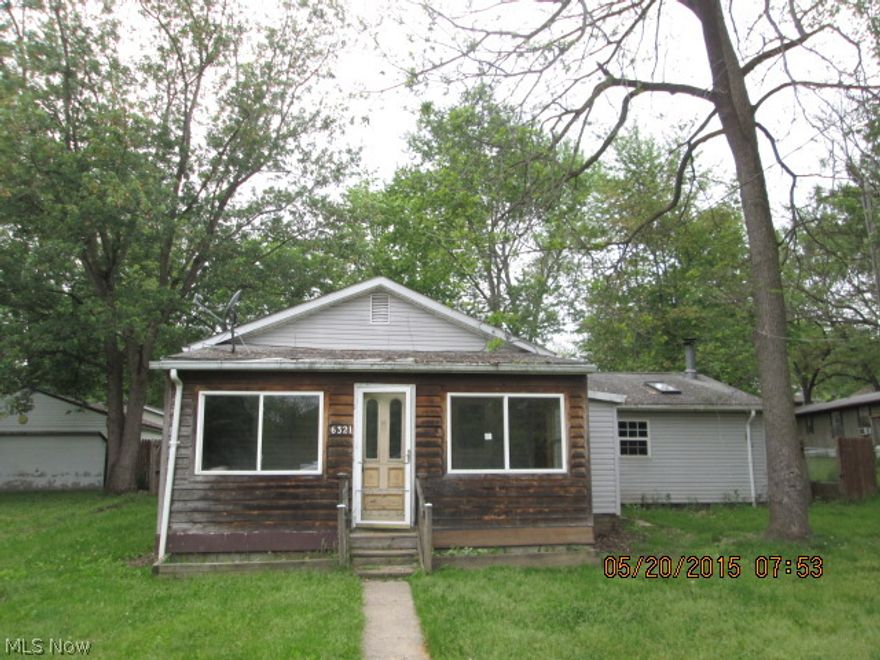 3 bedroom ranch with large family room, fenced yard & 2 storage sheds.