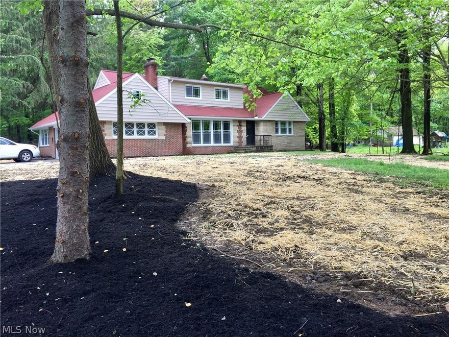 Beautifully renovated home on nearly 2  acres in Willoughby Hills. This stunning brick craftsman is sure to impress with over 3,400 sq. ft. of living space with open floor plan. The kitchen features custom white shaker solid wood cabinetry, granite counter tops, marble back splash, SS appliances, and hardwood floors throughout the first floor. All bathrooms are light and bright with custom tile work and new fixtures. The huge FIRST FLOOR Mastersuite is impressive with two closets, en-suite with dual granite vanity, and custom tile walk in shower. The spacious Family room will be a great gathering space, with a wall of windows, wood floors, and and ledge-stone fireplace. The upstairs features 2 massive bedrooms (18x20), full bathroom, and large loft. The finished basement (920 sq ft) is inviting with a wood burning fireplace, and large daylight window. The spacious sun filled sunroom off the kitchen, overlooks the private, wooded freshly landscaped yard and patio. There is a first floor