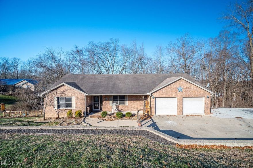 Welcome to 195 N Bruce Street in Little Hocking, Ohio—a well-maintained 3 bedroom, 2 bathroom brick home with a poured concrete wall basement and plenty of space to grow! Step inside to vaulted ceilings and an open-concept living room that flows into the kitchen and dining area.

The kitchen features granite countertops (installed 3 years ago) and updated appliances including a gas range, refrigerator, dishwasher, and microwave. Double doors off the dining area lead to the back deck, making it great for entertaining. A hot tub conveys with the home for added enjoyment.

A separate laundry room connects to the heated and cooled 2-car garage. The primary suite offers new carpet (Jan 2026), a walk-in closet, and an en-suite bath with a jetted tub and separate shower. The primary bedroom also includes access to the back balcony.

Two additional bedrooms offer fresh carpet (Jan 2026) and ample closet space, along with a second full bath. The basement provides outstanding room and potential for storage, recreation, or future finished space.

Updates include a Grogg’s furnace (Nov 2021) with semi-annual maintenance since installation, plus a water pressure system and water softener (Jan 2022). Pest and termite treatments have been completed every 3 months. Vivint home monitoring/security system conveys; buyer responsible for subscription if continued. Schedule your showing today!