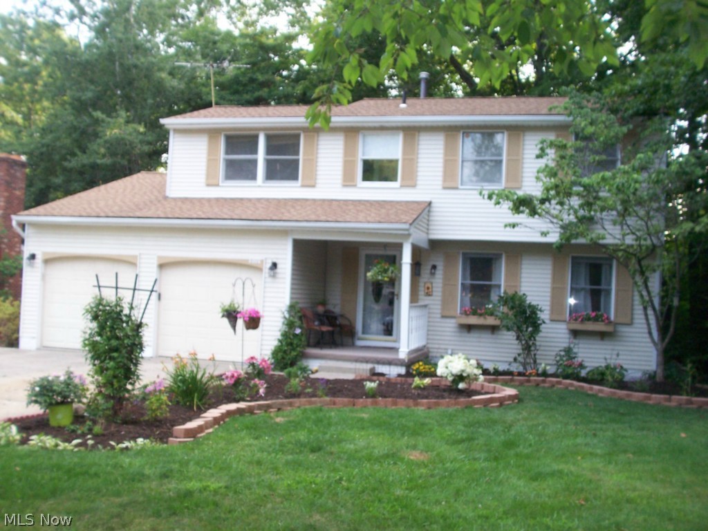 An exceptional 4 bedroom, 2.5 bath colonial with a finished walk out basement. Enjoy the private, treed lot from the sun room. The open kitchen has a center island, and the newer appliances will stay. A large family room has a fireplace. The 21x13 rec room walks out to the rear patio. There is a formal living room, formal dining, attached 2 car garage, and so much more.