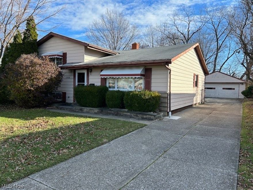 A spacious home and functional split level design. Living room, eat-in kitchen and spacious family room addition on main level. Three bedrooms and full bathroom on upper level. Large, L-shaped rec room with closet space, mechanical area, laundry room and 2nd bathroom in the lower level. Nice 22 x 14' cement patio in rear with awning cover. Two car, detached garage with newer automatic opener - new key pad and roller pins replaced. Situated on an approximate, 50 x 169' lot with fenced-in rear yard; rear boundary line is approximately 60' wide.

The kitchen is huge with ample cabinetry and counter tops! Spacious family room in rear with vaulted ceiling, skylight and corner fireplace with gas logs. Hardwood flooring, vinyl replacement windows and some recent updates in upper level bathroom. Newer storm doors at front and side entries. Kitchen appliances along with the washer & dryer included. Seller is proactively offering a home warranty. 

The home needs extensive updating yet habitable and priced accordingly ... great potential!