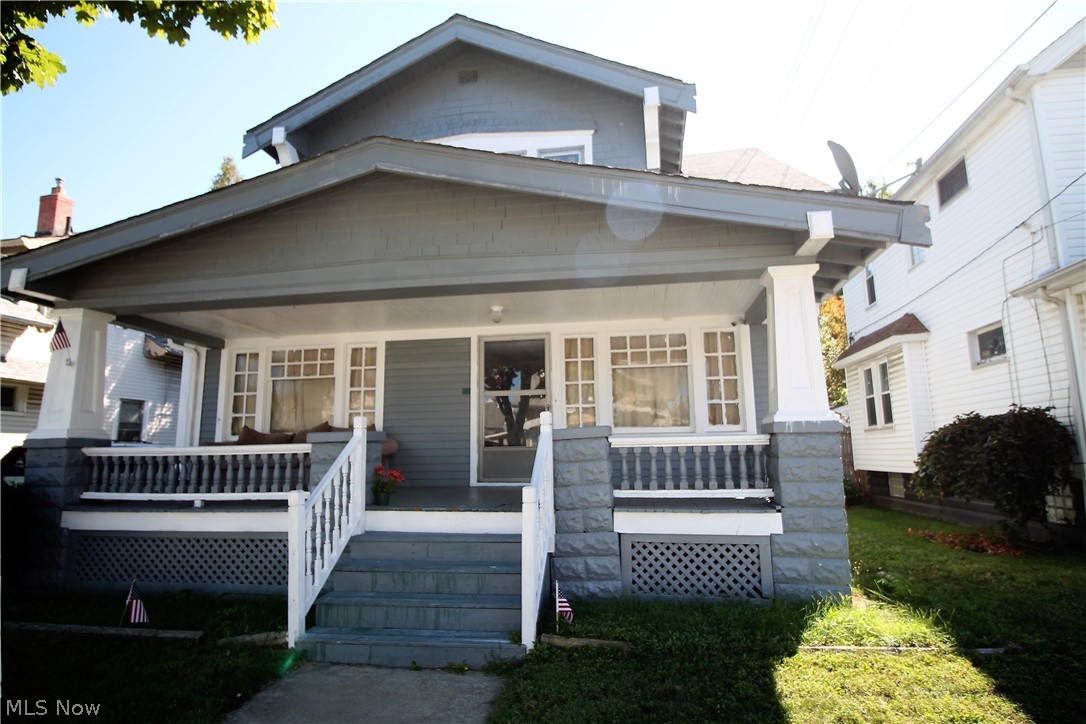 Welcome Home to this charming three bedroom, one and half bath home with spacious front porch. As you enter the home you will see the large living room with plenty of room for your family entertaining and is open to the great room currently used as an office and is open to the gorgeous dining room with built ins for storage, and a large window and hardwood flooring. Nice light, bright kitchen has plenty of storage space for all your kitchen needs as well as a little storage area with shelving and wood look vinyl flooring. There are three nice size bedrooms upstairs with a full bath. In the partially finished lower level there is an extra bedroom and extra shower. Many updates include roof in 2005, there is a total of five new windows, hot water tank 2012. The HVAC is serviced regularly. Nice size fenced in backyard and one detached garage which has a new garage door in 2018. Newer carpet. The possibilities are endless with what you can do to make this home your own with your special to