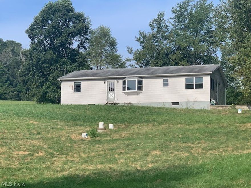 Country setting for this 3 br. 2 full bath ranch home with full walkout basement with open layout in the kitchen and dining area with bay window overlooking 3 1/2 -4 acres approximately.  New survey to be completed.  There's new carpet in the large living room with slider to the back yard, master bedroom has double closets and full bath with new vanity and freshly painted interior.  There's a first floor laundry with utility sink and breakfast nook area, appliances can stay.  Bathroom hookup in basement. Please note restrictions to be added at closing.   See broker remarks.    Seller to retain mineral rights.   Survey to be on the sides wood line to wood line and in the back just to include the trees at the edge.