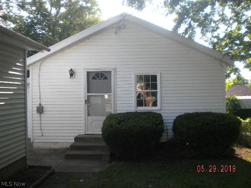 Cute 1 story bungalow, 1 bedroom, 1 bath, living room, kitchen.  Large 2 car detached garage, great for working on cars or a boat! Priced to sell - a little work would make this one a great investment!