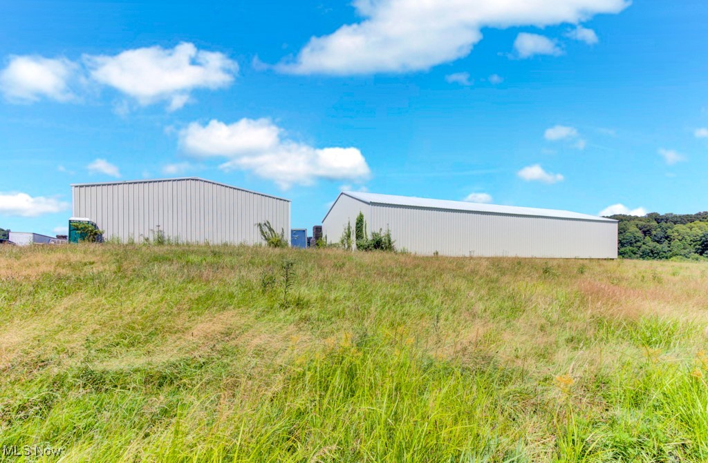EXCELLENT LOCATION, LOCATION, LOCATION for your next business opportunity! Situated on 5.0 acres of land just on the outside of Minerva Ohio, this property is currently zoned C-480 and is currently home to a pallet business in which the owner is dissolving. Features include a 60 x 80 metal building, with PHASE 3 ELECTRIC, fully insulated with a cement floor, and a wood stove heat. Large overhead door in the back of the building allows a semi-truck to access. Another 100 x 60 metal building needs some finishing touches and currently does not electric ran to it. Currently no water or sewer but city water is close by. Endless opportunities here from your own type of business, storage units and more! Owners are retaining mineral rights will transfer surface rights. All pallets and items on the property will be removed before transfer.