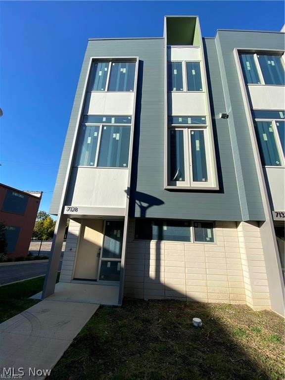 ONE MIDTOWN! Cleveland's newest development located in the Health-Tech Corridor. CORNER UNIT: Beautifully designed 3 bedroom, 2.5 bath townhome with tons of natural light. Open floor plan features a large kitchen with island and plenty of cabinetry.The spacious living area features a large and deep exterior balcony with sliding glass doors. Three bedrooms on 3rd floor with 2 full baths and a rooftop deck with panoramic views of the City! The interior is finely crafted featuring high-end standards and finishes • Open-concept spacious floorplan • Additional bonus room for office/den or additional bedroom • LVP flooring • Modern kitchen cabinets • Quartz countertops • Stainless steel appliance package • High-efficiency furnace and air conditioning • Modern hardware and fixtures • Attached two-car garage • Rooftop and balcony terraces with panoramic views. This unit is being built, no customization. AFFORDABLE: 15-Year 100% Tax Abatement—and can qualify up to $30,000 Greater Circle Livin