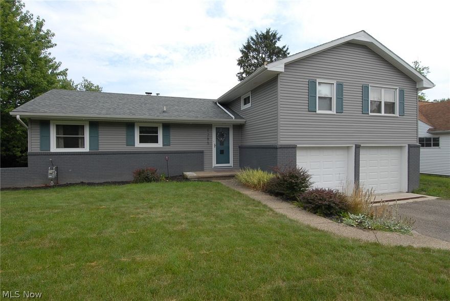 Immediate possession is available on this move-in ready Military Rd. address! Step inside this 3 bdrm, 1.5 bath bi-level, and let the stress of the day fade away.
A spacious eat-in kitchen, with a door to the side yard, offers views of the greenery of the Zanesville Country Club across the road; most of the cabinets have been child-proofed for peace of mind; the first-floor family/dining room stretches across the back of the home and has access to the rear concrete patio and backyard. Uni-Shield replacement windows grace the majority of the home. An over-sized two car attached garage has ample storage room; access to the basement and to the backyard! The paved driveway and paved semi-circular turn around, add safety and curb appeal at the same time! The side and backyard will provide you lots of outdoor possibilities. Right in the heart of everything North, this Military Rd. home is ready for you!