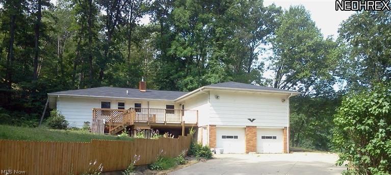This home is everything you have been looking for! Spacious ranch has a finished lower level with approx 1570 square feet of additional living space including a 4th bedroom, laundry, full kitchen and bath. With this home, you can give your large family space and privacy, live upstairs and rent the LL for extra income, run a home-based business or buy as an investment and rent as a duplex. Whatever you choose, you can do it right away because possession is immediate and all of the work has been done for you. Updates done by the current owners include roof on house and shed, entry doors and windows, forced air furnace and central air, 16'x20' deck with 8-person hot tub, updated flooring, well pump and upgraded lighting and electric. Enjoy a quiet, wooded setting only minutes from downtown Carrollton. Gas and oil rights are leased, but all mineral rights that current owners have will pass to the buyerINCLUDING ALL FUTURE ROYALTIES ON OVER 1 ACRE! AGENT OWNED PROPERTY.