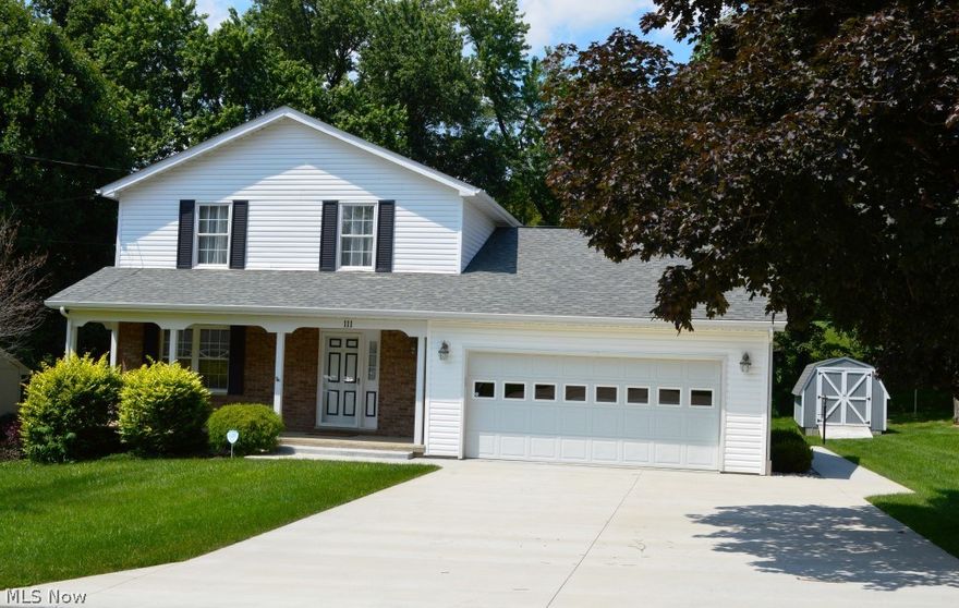 This home offers over $50,000 in upgrades and move-in ready! Entry off covered front porch offers slate floors and leads you to a spacious formal living room with beautiful hardwood floors flowing directly into formal dining room.  Kitchen has been completely updated and offers granite counter tops, hickory cabinets, plentiful cabinet space, bar area for dining and open to family room which offers wood floors, gas stone fireplace and French doors to tiered decks overlooking a level lot with mature trees - gas is plumbed to deck area for easy entertaining and grilling.  Second level offers 3 bedrooms - a spacious master bedroom with 2 walk-in closets, and a full bath with double sinks and private tub/shower area.  Lower level offers a 4th bedroom with full bath, storage area and laundry, and a great room.  Oversized 2 car garage with attic access and sits near the end of a cul-de-sac.  Some of the additional updates include: new carpet in upper level 2018, new flooring on first level be