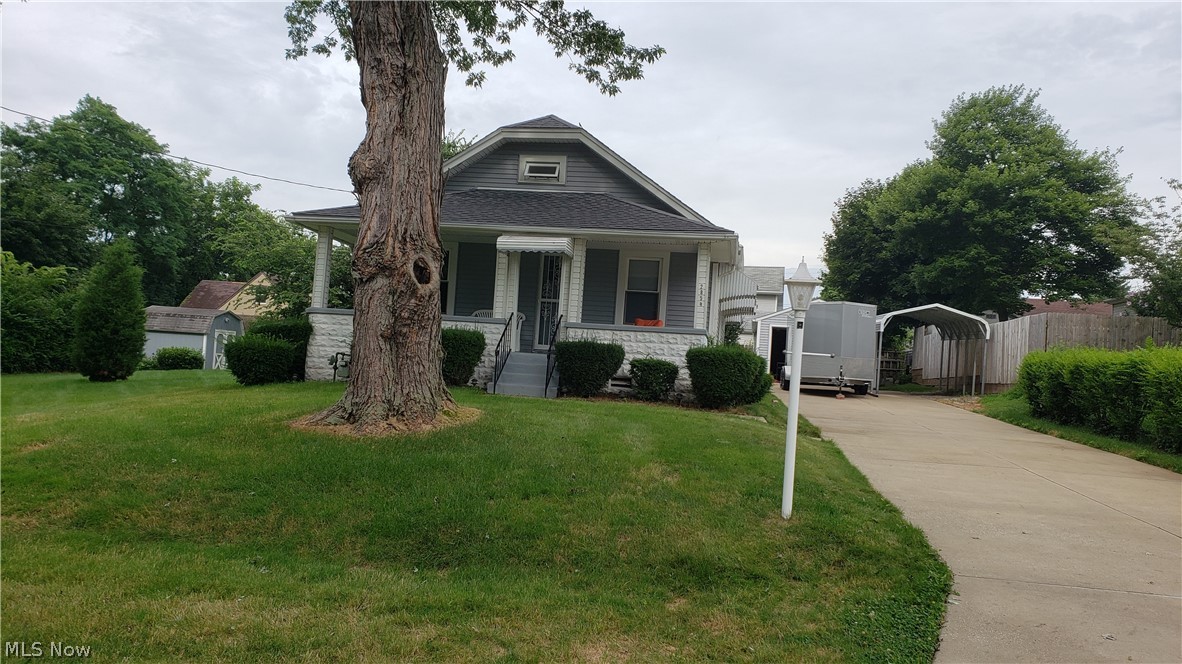 2854 Denman Drive .Perfectly located in a quiet neighborhood just minutes from the world famous Portage Lakes or the Highway and the city. Pull on up the bright white cement double driveway and park in your choice of the oversize 1 car garage or the carport (that stays) Take 3 small steps up the large solid concrete steps to front porch country living on the swing and admire the beautiful lawn on this extra large double lot with beautiful landscaping just waiting to be enjoyed. Front door opens to brand new carpet and paint in the living room and throughout so come in and see what little touches you might make to call this your home. Clean dry basement with extra room used as bedroom for many years. Some of updates include Vinyl siding, roof, windows, glass block. Immaculate Home you will not be disappointed!! Just bring your imagination and make it your own.