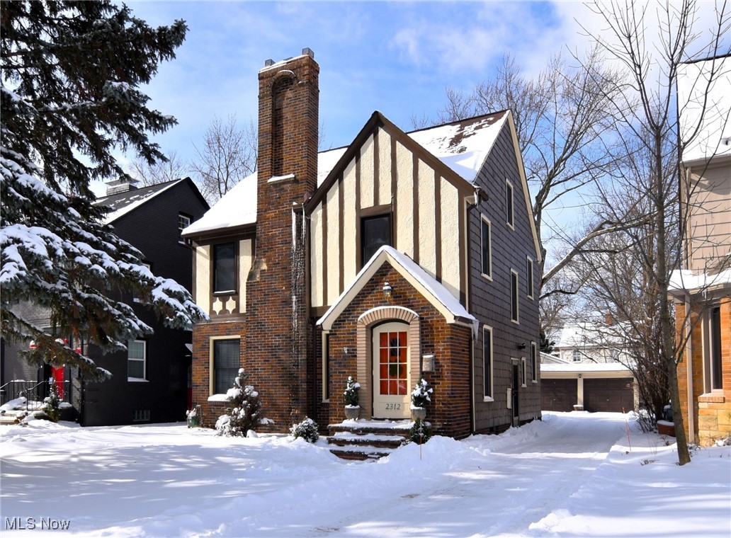 Fabulous Storybook Tudor with so much charm and attention to detail! This house is full of personality! There are rich hardwood floors throughout most of this house. The very light and bright spacious living room has terrific fireplace wall and built-ins and opens to the formal dinning. Off the dining room is the wonderful kitchen with luxury vinyl floors, white cabinetry and stainless steel appliances. Also off the dining room is an amazing sunroom overlooking the lush lot. An updated half bath completes the first floor. Upstairs boast there generous in size bedrooms. There is a 2nd fireplace in one of the bedroom's and a a large walk in closet with built-ins and porch in the owner's suite . There is a lovely full bath. The third floor has a 4th large bedroom and an inviting office area with sky lights. The recreation room is finished and can be used for whatever you needs are and a large storage area too! Located on a tree lined street. This home is move-in ready, all appliances, including the washer and dryer! Conveniently located just minutes away from a variety of restaurants, shopping, Whole Foods, John Carroll University, University Circle, hospitals, Little Italy and more . Again, this home showcases so much architectural details. Home warranty included! This one won't last! THIS HOME IS POS COMPLIANT.
