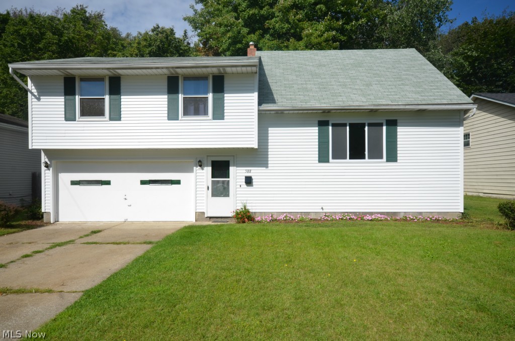 Remodeled home in sidewalk lined neighborhood! Tile foyer entry w ½ bath leads up to a big living rm w fantastic picture window letting in tons of daylight. Brand new kitchen with eating area features a pantry closet and slider to refinished deck and back yard. Upstairs features a brand new remodeled bathroom w tile floor and shower/tub plus nice sized bedrooms- and a big master bedroom at the top level! The lower level has a partially finished rec rm plus utility/laundry room. 2 Car attached garage w electric. Hardwood floors under bedroom carpet. Updates include: ’14 Vinyl Siding / Wrapped windows, Kitchen (Wood Laminate floor, Cabinets, Counter, Sink, Fixtures), Full Bath (Gutted to studs- new Tile floor, vanity, shower/tub, commode, plumbing), ½ bath (Tile floor, vanity, commode), Sliding Glass Door, Interior & deck painted, Living Rm Big Windows. ’11 Roof- complete tear off. ’03 Carrier Furnace. Hurry on this one!