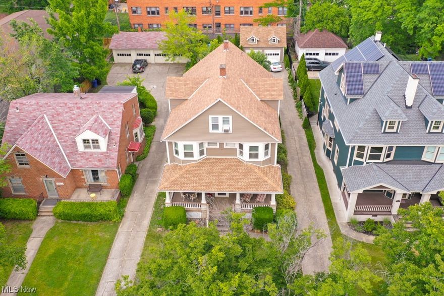 Discover an outstanding investment opportunity in the Edgewater neighborhood with this expansive multifamily property. Whether you seek short-term or long-term rental income or desire a spacious home as an owner-occupant, this residence offers the perfect blend of original charm and modern updates.

Spanning the first and second floors, the largest unit showcases captivating original hardwood floors and woodworking that exude timeless allure upon entering. The main level features a versatile in-law suite with a private entrance, providing an ideal space for families, solo travelers, or couples seeking privacy. Includes  private access to a fully remodeled bathroom.

Journeying to the second level, an elegantly updated full bath accompanies the primary bedroom. Two additional bedrooms are included on the second level, as well as a large den, another full bath, and an office. Continuing to the third floor, a separate unit offering mid-century charm awaits with its own private entranc