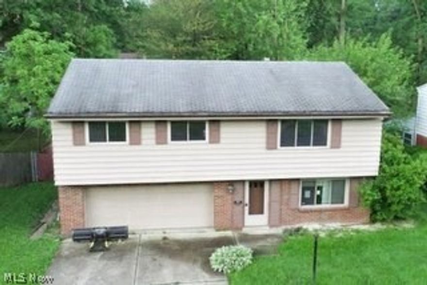 This home has a large deck out the back on the upper level and a patio out the family room on the lower level, 3 bedrooms, 1 full bath and 2-half baths needs your TLC!