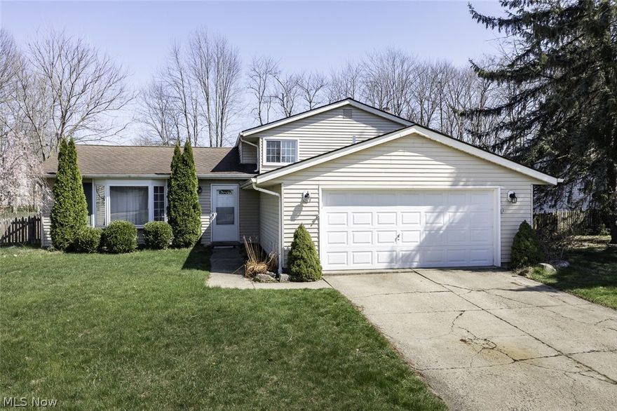 Beautiful split level on .30 acre fenced lot. Walk into the open foyer with wood tread stair and newer railing leading to upstairs. It opens to the formal living room and dining room with vaulted ceilings. Most windows are newer with transferrable warranty, redone in 2016. The kitchen is open to dining area and has a slider that opens to backyard and patio. Lower level family room has a gorgeous stone woodburning fireplace. The oversized laundry room has room for storage. There is a full bath off the laundry room. Upstairs there are three generous sized bedrooms and a full bath. There are many updates in the home; hot water tank 2017, new attic insulation 2022, chimney crown 2019, HVAC 2018, shed 2019, electric updated 2018, radon mitigation system 2022, interior doors approx 8 years. Attached 2.5 car garage has pull down storage. Come check it out today!