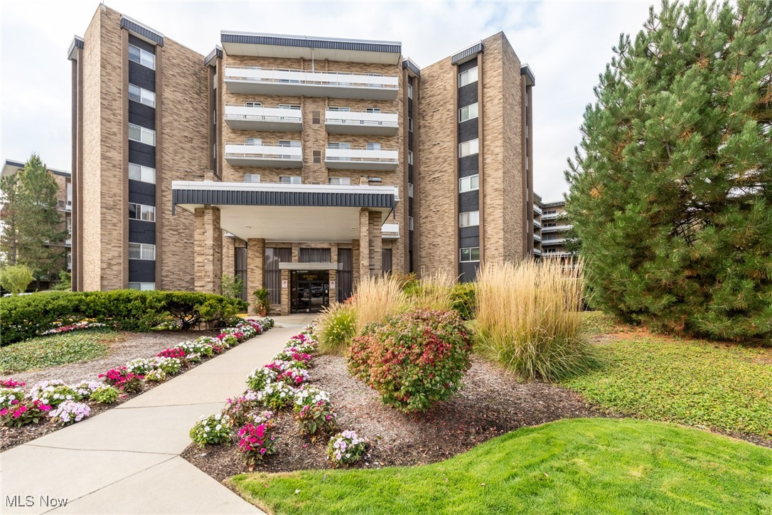 Light and bright unit on 4th floor in Acacia on the Green, just steps from the elevator and laundry area! With newer 2022 carpet throughout, the spacious Living room has newer 2022 windows and slider to full length balcony with views of the Courtyard! Dining room is in "L" shape with Living room for ease of entertaining larger groups or for daily dining! Kitchen with newer 2022 all white GE appliances including refrigerator, dishwasher and range. Bedroom with closet off living room is currently being used as an exercise space. Spacious Master bedroom has en-suite full bath with oversized step-in stall shower and large walk in closet! Full bath in hall has shower over tub! Also new in 2022: windows in both bedrooms, entry door handle and lock, thermostat, and light fixtures in Kitchen, Dining room, Foyer and Master bedroom. Acacia on the Green offers tremendous amenities including underground parking with garage space at $50.00 per month; 24/7 security, fitness room, Social Room and amazing swimming pool recently renovated with grills! PICKLEBALL courts for your enjoyment! Monthly fee includes cable with free Showtime! Great location directly next to Acacia Reservation of the Cleveland MetroParks, convenient to Beachwood Place/LaPlace and Legacy Village. Easy access to highway. Great value! Must see!