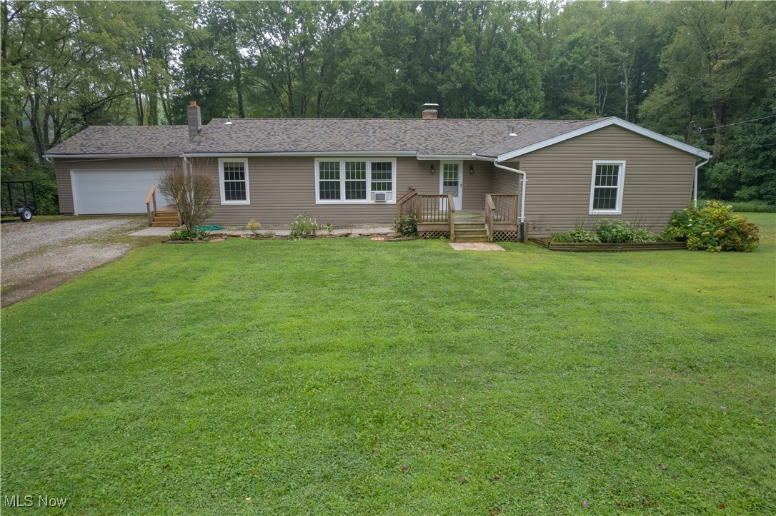 Welcome to this beautifully updated 4-bedroom, 2-bathroom ranch situated on 1.5 scenic acres in the desirable Crestwood School District. Step inside to find a spacious and inviting layout, featuring a large open-concept living area that flows effortlessly into the kitchen and dining room—perfect for family living and entertaining. Enjoy the warmth of nice hardwood floors throughout, along with spacious bedrooms designed for everyday comfort. The private master suite offers a peaceful retreat, complete with a walk-in closet. Recent updates include fresh siding, a newer roof, and updated windows, offering peace of mind and curb appeal. With single-floor convenience and room to spread out both indoors and out, this home offers the best of quiet country living with modern comfort.
