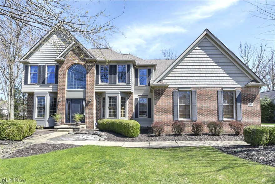 Prepare to be moved! Welcome to your dream retreat in Avon Lake’s highly coveted Bridgeside community! This stunning, beautifully maintained residence offers an expansive 3,499 square feet of living space, perfectly blending suburban elegance with modern comfort. From the moment you step into the soaring two-story foyer, you’ll be captivated by the bright, airy atmosphere and gleaming hardwood floors. French doors lead to a private flex space perfect for your executive home office or library, while the formal living and dining areas set the stage for effortless entertaining. At the heart of the home, the gourmet open-concept kitchen shines with crisp white cabinetry, granite countertops, an oversized wood island, and modern appliances. This culinary hub flows seamlessly into the two-story great room, where vaulted ceilings, a cozy gas fireplace, and a dramatic open catwalk create a truly "wow" factor.  The generous layout continues upstairs in the sprawling primary suite, a true sanctuary featuring vaulted ceilings, a dual dressing area, and a spa-like en-suite bath with a deep soaking tub and a sleek glass-enclosed shower. Four additional generously sized, light-filled bedrooms and two full bathrooms ensure plenty of space for everyone. Looking for more fun? The finished basement is an entertainer’s paradise, complete with a custom wet bar and a pool table ready for your next game night! Step outside to your private outdoor oasis, where a stamped concrete patio, designated dining area, and stacked-stone fire pit are framed by mature trees and lush landscaping. Located just minutes from top-rated schools, Lake Erie views at Veterans Memorial Park, and an easy 30-minute commute to Cleveland, this home truly has it all. Don’t miss out—schedule your private tour today!