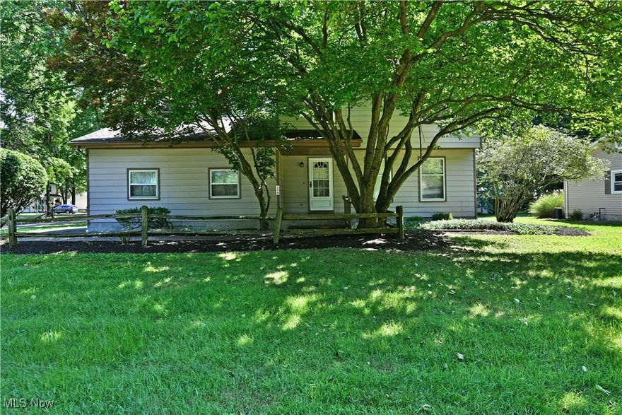 An expansive, move-in ready four-bedroom home nestled within a highly desirable Cortland neighborhood; and it’s all waiting for you! Sounds too good to be true? Take a closer look and hurry in today because this charmer won’t be around for long. The lovely residence rests in a veil of natural beauty as tall trees offer shady privacy and a park-like backyard setting as you sip cool drinks from the raised rear patio. Manicured mulch beds lead up towards the formal front entrance as a two-car attached garage enjoys easy access from the wrapping lot. Inside, the foyer runs along the main staircase as the posh living room beckons with tall windows and soft carpeting.  Formal dining sits just around the corner with sliding doors opening to the rear patio for easy summertime access. Peering into the kitchen, continued hardwood style flooring pairs with the array of complimenting cabinetry for plenty of storage space. Nearby, a first-floor full bath is tied to a master bedroom suite with a walk-in closet. The handsome living room completes the package with its engaging brick mantle, rear bay windows and additional sliding doors. Upstairs, three more spacious bedrooms branch from the main hallway. Meanwhile a second full bath is just steps from the landing with its updated vanity and shower. Enjoy basement rec space with a pool table, prime for entertaining, Laundry services, utilities and a crawl space round things out.