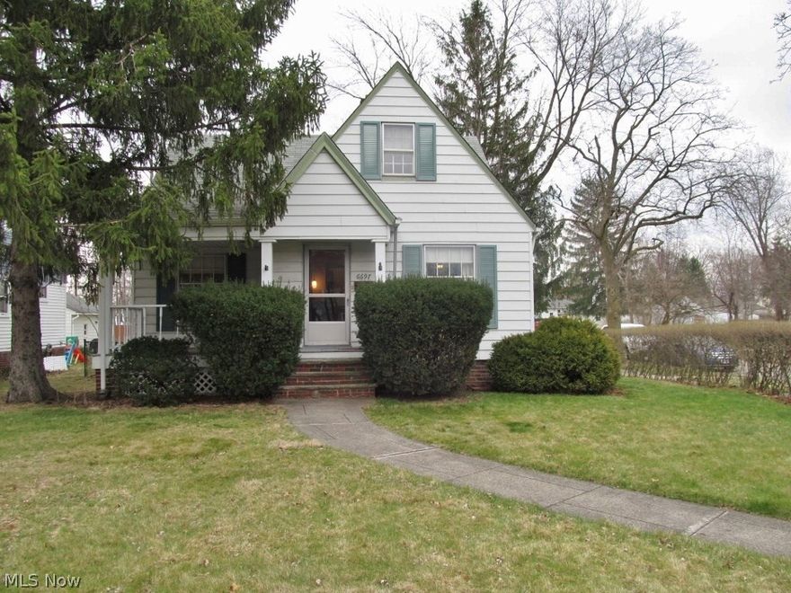 Immediate possession! Easy to show! Very longtime family owned home with charm and character throughout. This 4 bedroom cape cod home includes a built in china cabinet, decorative stone fireplace, built in bookcases, glass door knobs and hardwood floors. Kitchen features an arch opening. Dining room boasts chair rail and crown molding. Large owner bedroom. Basement has large laundry area, workshop, space for a recreation room and 2 canning rooms. Extra large yard with a half basketball court and garage with a shed attached. Front covered porch. Loads of storage. Walk to parks, schools, shopping and restaurants. 1 year HMS Home Warranty.