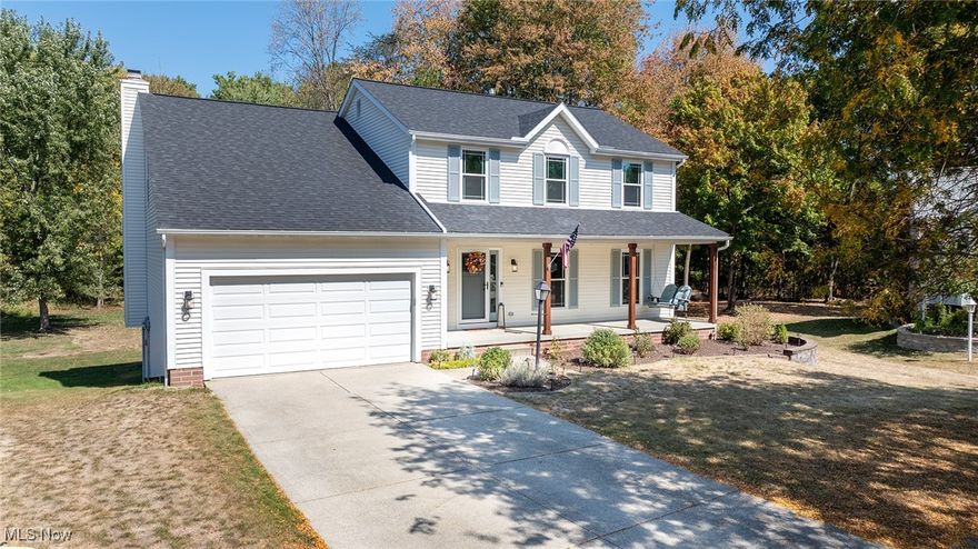 Exceptionally updated and meticulously maintained colonial available in Tallmadge! Welcoming covered front porch invites you into the homes spacious interior.  Flanking the foyer you'll find a large formal living room (currently used as an office).  The living room opens to the stylish formal dining room.  Off the dining room you'll enjoy a stunning updated kitchen with high end soft close cabinets,  granite counters and stainless appliances.  Kitchen opens to to a lovely family room with a fireplace, offering plenty of space to gather and entertain.  French doors in the kitchen lead to an expansive back deck overlooking a private  back yard with plenty of room to run around and woods beyond. Back inside, a conveniently located half bath finishes off the first floor.  Upstairs you'll fins a massive primary suite complete with a huge walk in closet, and gorgeous en suite bath with a separate shower and soaking tub.  Down the hall are 3 very good sizes bedrooms all with great closet space, and an additional guest full bathroom.  Impressive lower level with full sized windows include a comfortable rec room and a huge 5th bedroom with a walk in closet.  The lower level also offers a great amount of storage and laundry room.  Updates throughout the home including all new 3 pane UV blocking windows and front door in 2022, water tank in 2025, new roof 2022, new HVAC in 2019, new gas range in 2025. Property is situated in a beautiful residential neighborhood at the end of a charming cul-de-sac.  Nothing to do but move in! Dont miss it!