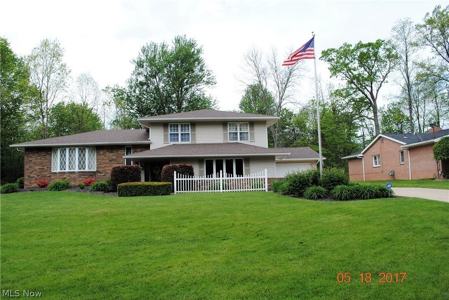 A home like this only comes available once in a lifetime! Phenomenal 4-level split features 3 bedrooms, 3.5 baths, remodeled kitchen w/center island, family room w/fireplace, formal dining room & 4 car attached garage. Unique features include large deck off kitchen w/retractable awning, spacious covered Nature Stone patio & very private back yard.  Lower full bath has steam room & basement floor is all ceramic. Updates include roof, central air, furnace & hot water tank in 2012, vinyl siding in 2007, exterior Pella doors in 2010, kitchen in 2000,  center island & new granite countertops in 2008. Professionally landscaped & very neutral decor throughout, a true pleasure to show.