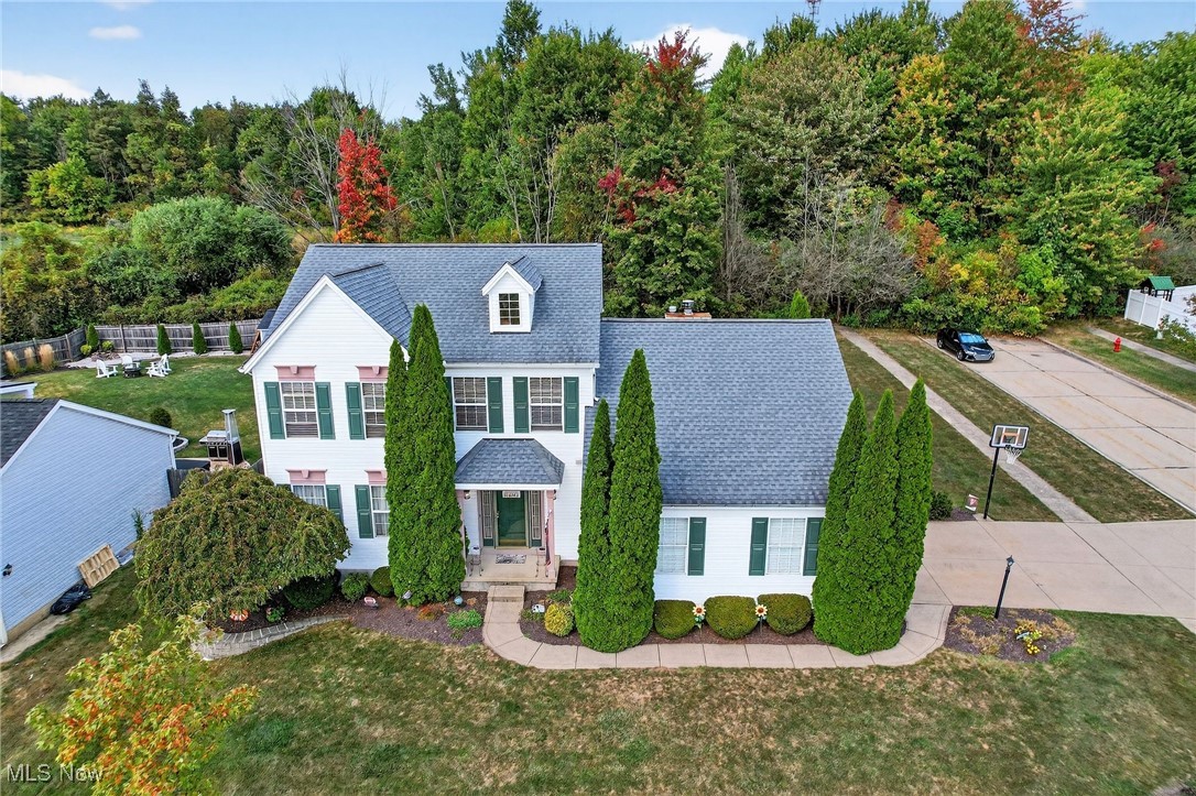 Discover a most welcoming 3 Bedroom, 2.5 Bath timeless colonial home with A+ Curb Appeal within the coveted Mueller Creek community in the heart of Brunswick! The original owners are now offering this desirable corner lot property featuring an oversized 2 car attached garage, expansive, private rear yard with large patio and shed (A/C new in '25) & a floorplan that seamlessly functional. Well appointed and meticulously maintained, the main level is ideal for entertaining as it showcases an oversized Eat-In-Kitchen w/Pella sliders to the rear yard, a vaulted and equally spacious Great Room with handsome fireplace, and adjoining formal Dining Room. Floor coverings, whether it be the granite-hued carpeting or the highly durable laminate, offer a neutral, tasteful foundation suitable for a wide array of decor. The front entrance features a generously sized Foyer that takes center stage for your seasonal decorations, ushers you to the upstairs Bedrooms with its stately staircase, & includes a coat closet, convenient Half Bath & Mudroom (also accessible from the garage) where the First Floor Laundry is conveniently located (washer/dryer included). The oversized Kitchen features a gleaming white appliance package (electric stove new in 2024), a cavernous pantry area, and a great abundance of cabinetry to house all your culinary gear in perfect order. A hand-hewn island, as beautiful as it is functional, completes the kitchen and will convey, together with all appliances. The Bedrooms upstairs all feature plush, neutral carpeting, generous closets, new lighting and well maintained bath accommodations. Comfort height commodes are located in the primary bath and half bath, and the owners suite is vaulted, includes a shower and garden tub in the ensuite bath, and a walk in closet to accommodate any fashionistas on title. The mammoth basement, pristine, unfinished and ready for your gameday dreams, is bone-dry, hosts maintained mechanicals, and completes this beautiful home!