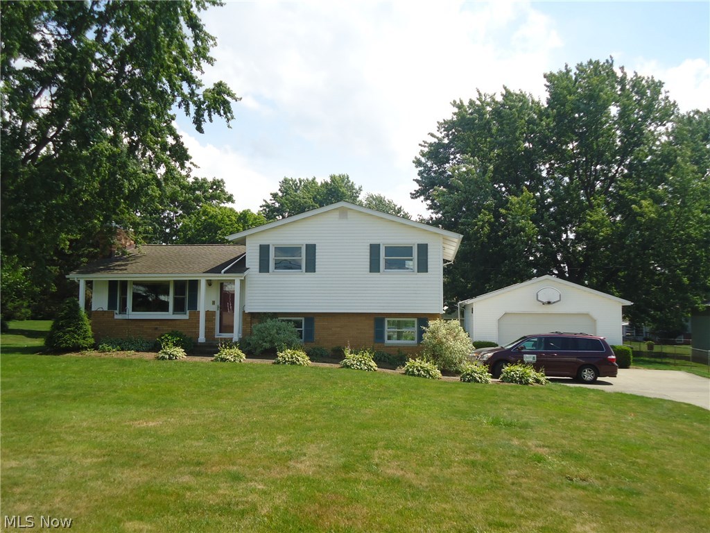 Wow!! This is not your typical split! Gorgeous and inviting 4BR/2B home on a picturesque lot overlooking pool and well maintained yard. Stunning custom built maple kitchen with granite, opens to a spacious, fireplaced living room with bay window... Beautiful Sunroom addition leading to large deck. Finished Lower Level with family room & office area. Remodeled Baths feature jetted tub/tiled surround & granite countertops. Large 24' x 32' Garage built in 1998--Call today for a private showing--you'll be glad you did!