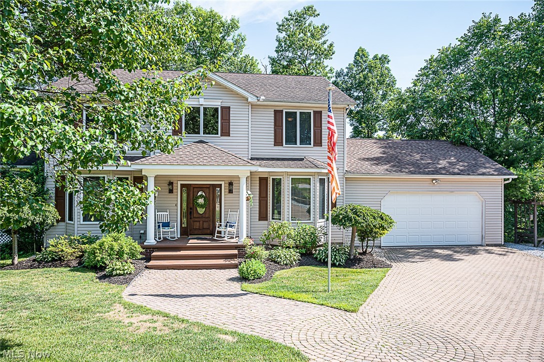 Stunning Colonial (4 BR, 3 1/2 Baths) offering privacy from neighbors with amazing scenic location overlooking the Grand River Valley. Highlighted by a 3 season Indoor/Outdoor Living Area w/ Brick Fireplace...this is the home for someone looking for a calm and peaceful environment to call home. Built by a Custom Home Contractor to be a retreat to raise his family, this is one of those homes built with extra care and attention to details not found in most new construction (9' ceilings, Azar Solid Block Construction). Designer Kitchen with Hickory Cabinets, Granite Counters and Island with 10' Bay Window offering scenic views. Also, there is a formal dining area and multiple living areas for everyone to have their space. Recent Updates include: Kitchen, Master Bath and Furnace (2017),1st Floor Laundry, Walk Out Basement, Upper and Lower level Decks off 1st Floor and Lower Level (Upper Level is Trex Deck). Custom Paver Driveway, Wood Fireplace in Living Room w/ gas quick start, Wood stove