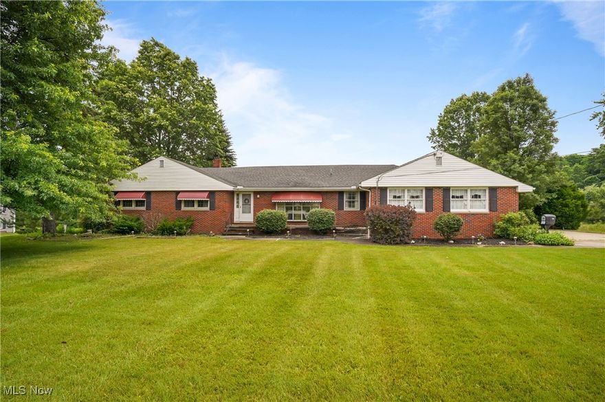 This sprawling brick Ranch situated on 1.3 acres  is in a prime Aurora location. From the foyer entry with its slate tile floor  you'll find a nice open floor plan that includes a bright and  spacious formal living room and dining room which overlook the sunken family room with wood beamed ceilings, a fireplace and an extra gas heater. From the family room is a nice 17 x 16 room addition with closet that could be a 4th bedroom or sunroom. The warm and cozy eat in kitchen has lovely oak cabinets and plenty of natural light shining through the  large picture window. There is also a first floor laundry room and 1/2 guest bathroom. Down the hall you find three bedrooms and two full bathrooms. The lower level has a king size rec room measuring 40 x 14. It has a beautiful  large brick platform for the Ben Franklin wood burner. The basement also includes two more finished rooms and a full bathroom. Outside is a large concrete driveway and storage shed. New roof in approximately 2017 and new AC in 2020. This is a solid well built home which has been filled with love for many years. It is priced to sell with room in the price for updates.