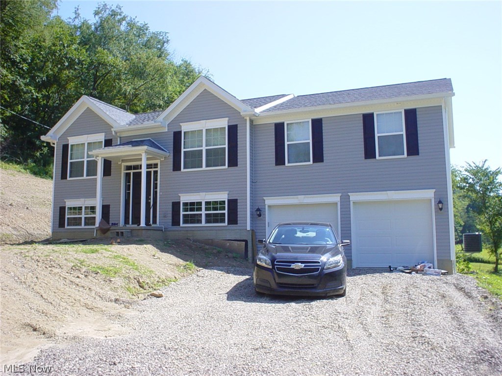 Country Bi-Level home on 2 acre lot features 3 BR, 3 Baths, unfinished 4th BR in lower level. Huge Family room w/gas log fireplace. Open concept living. Only 3 years old.
