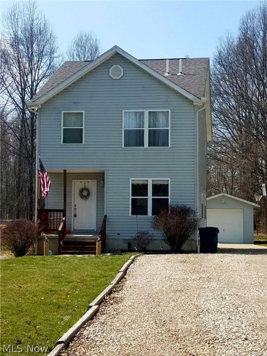 Beautiful 3 bedroom, 2 1/2 bath colonial built in 2006!  Still feels like new inside.  You will love the fully applianced, open, kitchen overlooking the large living room with comfy gas fireplace, and wood laminate floors for ease of cleaning and care.  Other perks include 2nd floor laundry room, which is so nice and eliminates those trips to the basement.  Very deep backyard with large deck (20x10), stone patio (14x18) adjoining above ground pool.  Great family areas to gather with a fire pit in the back and woods to explore!  Includes 10x20 outbuilding and 1 car detached garage. Call today!