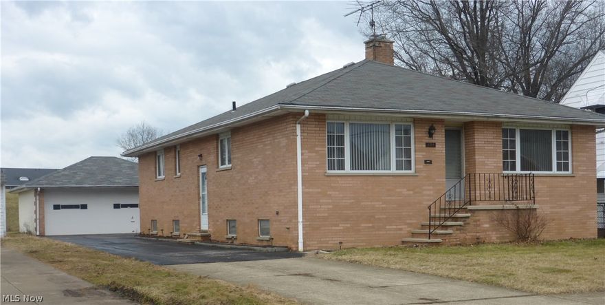 Move-in ready!  A charming 4 bedroom, 3 bath, all brick house with a 2 car detached garage.  Many updates: freshly painted, new laminate flooring, full finished basement with a fireplace and an in-law suite.  Close to freeway, schools, shopping, and hospitals.  Quiet area!  Must see to appreciate!