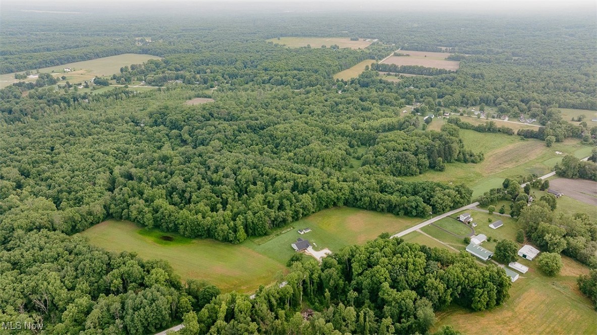 97-Acre Farm with Two-Story Farmhouse, 40 X 80 Morton Building, 72 X 24 Garage, Livestock Barn & Other Good Storage Buildings, Tillable & Wooded Tracts with Timber & Mahoning River Passing Through, Loads of Deer & Turkey. Offered In Two Combinations with a Total Of 6 Parcels. Portage Co., Paris Twp. Live Onsite with Online Bidding Available on Real Estate & Major Equipment. ABSOLUTE AUCTION all sells to the highest bidder on location. ONLINE AND LIVE ON-SITE BIDDING WILL BEGIN SATURDAY, JULY 26, 2025, 10:00 AM, REAL ESTATE SELLS AT 10:30 AM. Real Estate Divided as Follows: SALE #1: 60+ Acres, Parcel #1 through #4 offered separate and together, multi-par. Parcel #1. 14.1 acres on the corner of McLain & McClintocksburg Rd. with a two-story farmhouse, vinyl siding, updated windows. 40 X 80 Morton building with concrete floors. 24 X 48 garage with concrete floors. 24 X 24 insulated and finished room with wood stove. 64 X 24 shed with 16’ lean-to, concrete floors, feed bunk, drive-thru. 32 X 48 three-bay pole barn and 48 X 26 four-bay storage shed. 24 X 54 chicken barn with block foundation. 14 X 12 garden shed. Parcel #2. 17.4 wooded acres have been select cut. Great hunting tract. Parcel #3. 13.3-acre hideaway, mostly open ground. Parcel #4. 16 acres, mostly tillable
SALE #2: 36.5 Acres sold multi-par. Nature & Hunting. Parcel #5. 24.3 mostly wooded, some timber, and the Mahoning River passing through. Parcel #6. 12.2 acres, half wooded with some timber, and the Mahoning River passing through. NOTE: Buildings are shown by appointment or Open House on July 19, 2:00-4:00 PM.