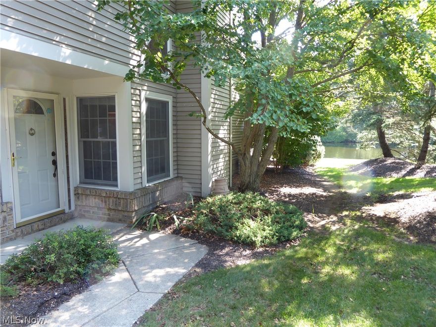 Don't miss this rare opportunity in King James North; end unit ranch townhouse right on the lake! Bring your design ideas and make this spacious 2 bedroom 2 bath condo your own.  Features vaulted living/dining room with fireplace, large eat-in kitchen with a light filled dining area, large master with views of the lake, walk in closet, ensuite bath with double vanity, soaking tub and large separate shower, second bedroom with views of the lake, library/office, laundry room and light filled sunroom with direct access to a deck overlooking the lake. Association has community room and pool just steps away.  Excellent access to I-90 just off of Clague Road. This is one of very few condos that sit on the lake.  These do not come on the market often.