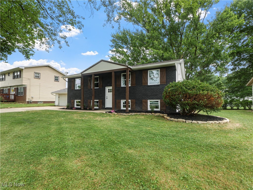 Welcome to this beautifully updated split-level home offering a stylish blend of fresh interior finishes, practical updates, and inviting outdoor living. Nestled in a quiet neighborhood with mature trees and excellent curb appeal, this move-in-ready property is sure to impress the moment you arrive.
The striking exterior features bold black brick, white siding, wood-tone shutters, and clean architectural lines. A wide concrete driveway leads to an attached two-car garage, providing ample parking and storage.
Inside, the home features fresh paint throughout, updated flooring, and a bright, open floor plan perfect for both daily living and entertaining. The living room flows seamlessly into the dining area and updated kitchen, where you’ll find clean finishes, newer cabinetry, and access to the large covered deck—ideal for grilling, dining, or morning coffee with a view.
The upper level includes spacious bedrooms and an updated bathroom with modern fixtures. On the lower level, you’ll find a finished bonus living area plus a private bedroom—ideal for guests, in-laws, or a quiet home office. This level also includes a stylish second full bath and access to the partially finished basement with epoxy-coated floors, perfect for a workshop, hobby room, or storage. Utilities, ductwork, and the water heater are conveniently located here.
Step outside to a backyard built for relaxation and entertaining. The highlight is a custom gravel firepit area with natural stone retaining walls—perfect for cozy evenings with friends. A spacious grassy yard offers room to play, garden, or unwind, with mature trees providing natural shade.
This home combines thoughtful updates, clean style, and great outdoor features in one complete package. Whether you're looking for your first home, your next home, or an investment, this one checks all the boxes. Schedule your private showing today—opportunities like this don’t last!