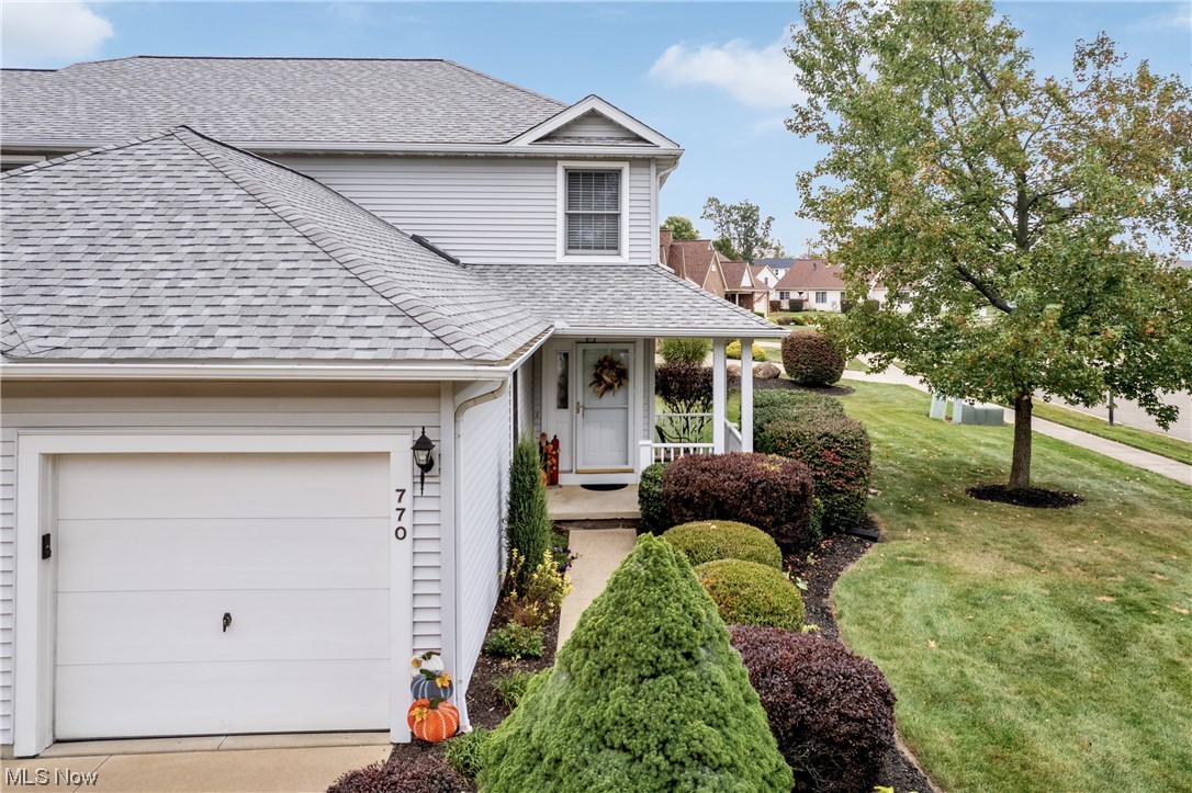 This tastefully updated corner unit condo is just what you have been looking for! You are greeted with a wraparound front porch overlooking the park like setting and meticulous landscaping. Take a step through the front door and you will appreciate the open concept living style! The kitchen, dining area and living room are a grand space! Perfect for entertaining and equipped with new flooring, paint and light fixtures throughout! A half bath completes the main floor. Upstairs you will find two generously sized bedrooms and a full bath, complete with a garden style tub! New trim, paint, carpet and lighting top off the second-floor updates that were just completed this year. The lower level has a space for laundry, ample storage, and an area that could be used as a rec room or a gym. Major updates include new roof 2022, waterproofing 2020, and new geothermal furnace in 2017!! Maintenace free living awaits, schedule your showing today!