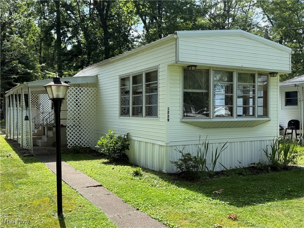This beautifully maintained mobile home is located in a quiet, well-established 55+ community offering the perfect blend of comfort and convenience. Situated just minutes from shopping, dining, and all that the heart of North Canton has to offer. This home is an ideal place for those seeking a low-maintenance lifestyle. The key features include 2 bedrooms, 1 bath; a cozy, functional layout for relaxed living, and new vinyl floors for a fresh, modern look. Peace of mind with updated plumbing. Enjoy the friendly, peaceful environment designed for residents 55 and older. This home is a perfect balance of affordability and style in a prime North Canton location. Whether you're looking to downsize or find your next home, this mobile home is a must-see.