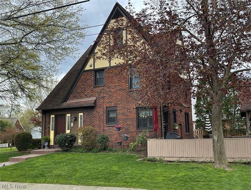 Love, care and good taste are the hallmarks of this 3-bedroom Tudor style revival on beautiful Chestnut Blvd., in Cuyahoga Falls. This light-filled home has been remarkably maintained. The Seller was careful to remodel with the respect the home deserved. You won’t mind spending hours in the updated, gourmet kitchen, complete with warm-colored birch cabinets, stainless steel appliances, ceramic flooring and granite countertops. Wonderful and free-flowing, this home will be great for entertaining. The kitchen has a lovely, functional island that will be great for setting out food for guests, or for daily dining. The formal dining room opens perfectly to the living room. The hardwood floors have been expertly-refinished, and a powder room has been conveniently added to the main floor, off the foyer. The second floor features a large master bedroom that will easily accommodate a desk, or a couch for extra seating. There is also access to a fantastic 27 ft. third level that could be convert