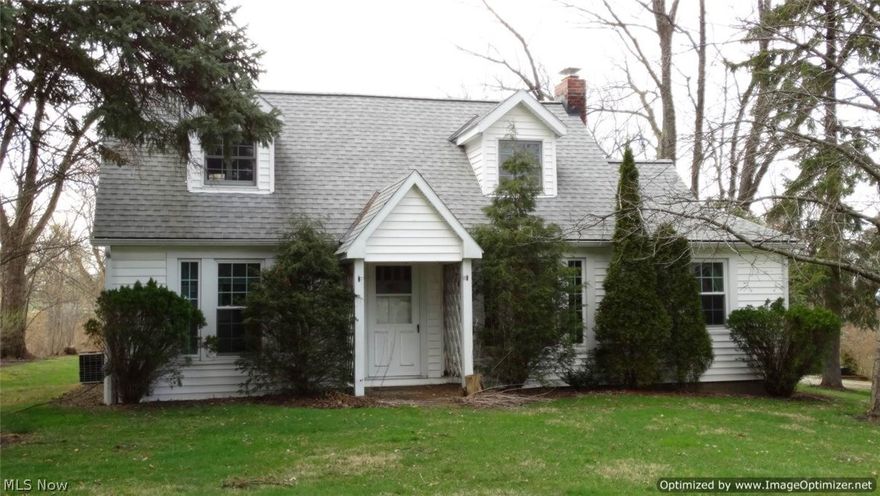 Charming 3 Bedroom & 2 Full Bath Cape Cod beautifully set on nearly 2 acres! Updated Kitchen with granite counters, ceramic tile backsplash, wainscoting, all appliances and hardwood floors through to Dining Room. Living Room with picture window, 2 Bedrooms with hardwood floors & updated full bath complete the first level. Second floor offers large Master Bedroom with walk-in closet, office/sitting area & recently updated full bath. Central air. Basement with great storage & laundry area with washer & dryer included. Newer roof & vinyl windows. 2-car detached garage with storage above, shed & newly built wood deck on extra deep lot. Just minutes to highway in desirable Kirtland School District!