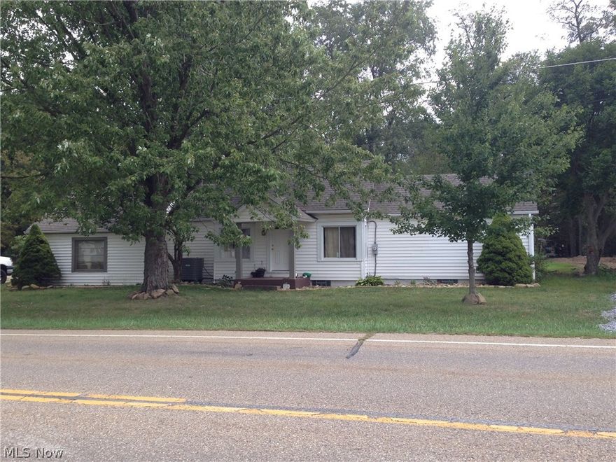 Priced right for a quick sale! This ranch home is full of personality and updates including roof/gutters, heating/cooling system, windows/doors & floor coverings throughout. What was once a sun-room has been fully enclosed to create a perfect guest bedroom or office with its french doors and fireplace that has been cleaned and is ready to go. Step out onto the huge stamped patio that was added to the existing covered patio area & completes the perfect outdoor living area. In addition to the attached 2 car garage, the seller has just completed an over-sized detached double garage complete with vinyl siding, metal roofing, cement floors insulated walls and electric. Contact me today to see this one for yourself - you will not believe everything you are getting for under $120K - all conveniently located just 3 miles from the Southside of New Phila!