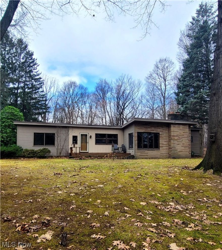 This charming property is situated on a spacious 2.19-acre lot, offering plenty of room to roam and enjoy the outdoors. With three bedrooms and one and a half bathrooms, this property offers tons of built-ins. The eat-in kitchen is perfect for casual dining and provides a cozy space to gather with loved ones. Although the property is in need of updating, it is in great condition overall, with well-maintained features and a solid foundation. The private setting, surrounded by majestic trees, creates a serene and peaceful atmosphere, making it an ideal retreat from the hustle and bustle of everyday life. One of the highlights of this property is the great outdoor space it offers. Whether you enjoy gardening, hosting outdoor gatherings, or simply relaxing in nature, this property provides the perfect backdrop for all your outdoor activities. Don't miss out on the opportunity to make this property your own and transform it into the home of your dreams. With its desirable location, spacious lot, and potential for customization, it offers endless possibilities for creating a truly unique and personalized living space.