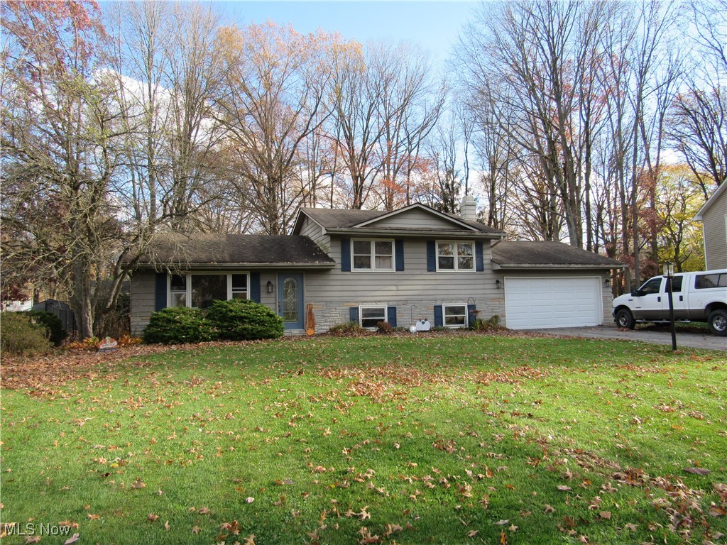 MOVE IN READY home located in Boardman Township and Canfield School District. The home offers a lower level with a half bath, family room with a fireplace and laundry area with access to the attached two car garage. The main floor offers a living room, kitchen, dining room and the 4 season/sunroom which is currently being used a gym but this room adds additional living space. The 4 season room has access to a back deck and backyard which is fenced. The second floor is where you will find all your bedrooms and the full bath. The primary bedroom has a separate entrance to the full bath.