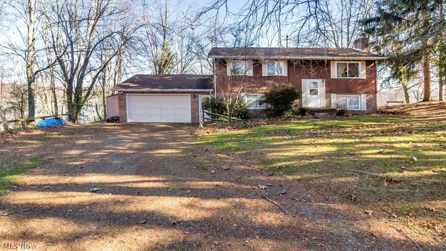 Amazing year around lake views, flat driveway, private lot,  gorgeous back deck (partially covered) and patio area…what else could you want at Lake Mohawk?  Not only is the outdoor living area just breathtaking, it also has an attached oversized two car garage, a fully finished basement with a full bathroom, laundry room, wood burning stove with a barn beam mantle, and walks out to a lower level patio area to enjoy those lakeviews.  Currently, the basement is set up with a kitchen with stove and refrigerator and bedroom area along with another living space with a brick interior wall.  The main level has a cozy living area and kitchen that walks out to the deck.  Three spacious bedrooms with ceiling fans and one full bathroom with new luxury vinyl flooring on the main floor.  Geothermal (2005), Refrigerator (2021). You don’t want to miss out on this fantastic opportunity at Lake Mohawk.  Lake Mohawk is a private gated community, with a 500 acre lake, unlimited horsepower, 3 beaches, 9 hole executive golf course and much more!  Set up your private showing today.