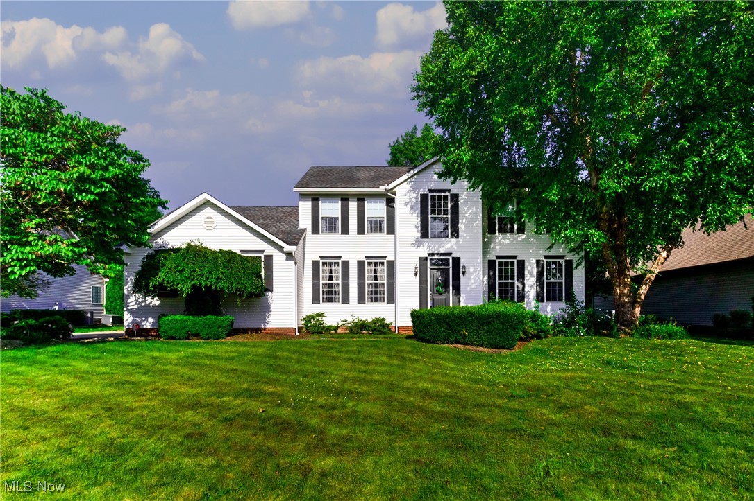 Welcome to this spacious 4-bedroom, 2 ½ bath two-story family home located in a desirable Country Club SE neighborhood. From the moment you enter the grand two-story foyer with a gorgeous wood staircase, you'll be impressed by the attention to detail and thoughtful layout. The heart of the home is the extra-large eat-in kitchen featuring a generous center island, all appliances and plenty of room for gatherings. The open floor plan affords a view of the adjacent spacious family room with cozy gas fireplace. Host dinners in the elegant formal dining room and enjoy the convenience of a back foyer area offering a bright laundry room (washer, dryer, built-in cabinets & sink included), a large walk-in pantry with built-in shelving, an additional pantry closet and a roomy half bath. Upstairs, retreat to the primary suite with a gas fireplace, vaulted 11-foot ceiling, dual walk-in closets, and a luxurious master bath with a Jacuzzi tub. Three more generously sized bedrooms and another full bath complete the second floor. Additional features of this beautiful home include 9-foot ceilings on the first floor, solid 6-panel doors throughout, recessed lighting, all window coverings and a 12-course basement that is plumbed for an additional bath and ready for your finishing touches. The oversized 2-car garage has an abundance of storage for your growing family. Relax outside on the brick front porch or rear brick patio. Immediate possession is offered on this stately two story. Schedule your private showing today.