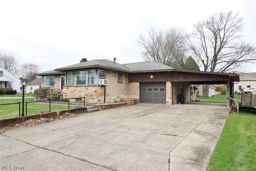 This ranch home sits on 4 parcels with a New kitchen cabinets and countertops , newer stainless steel appliances, large living room , with 2 bedrooms , hardwood floors throughout, partially finished basement with woodburner , one car attached garage with carport, 24 x 42 detached  garage , summer kitchen 10 x 14