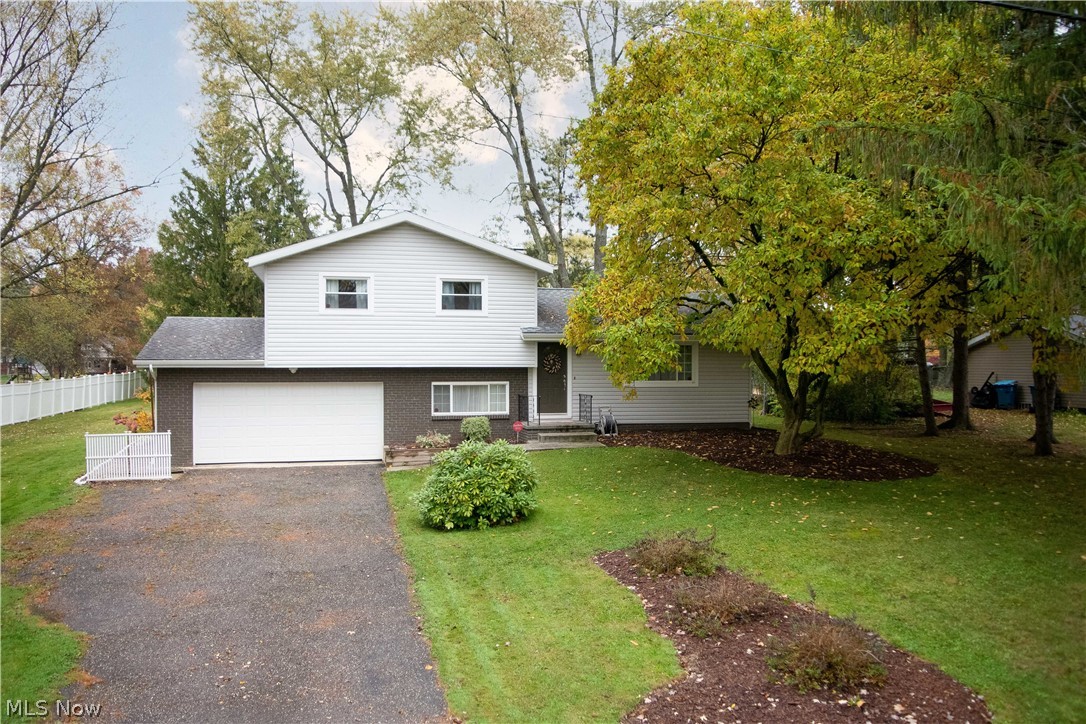 Beautiful Copley home that is a fully updated split level home w/ 3 bedrooms on the upper level, 2 FULL baths, Open Concept Kitchen, Dining and Living area on the front door entry level, w/ garage ground level Home Office for great use during these times of working from home & school sessions at home, rounded out by the Theater Room, Laundry Room & Uility Room on the basement level. This home has been completely remodeled from top to bottom over the past few years including a gorgeous open concept Kitchen w/ granite countertops & beautiful cabinetry, w/ functional island, Bathrooms are beautifully appointed & look straight out of a designer magazine, tile & bamboo Flooring for easy cleaning, the Theatre Room in the lower level even has a 2nd raised flooring for movie showtime! Move in ready w/ just about everything completed in the past few years including new furnace 2018, new central air conditioning 2018. Brick & newer vinyl siding, newer vinyl windows, interior doors, designer ligh