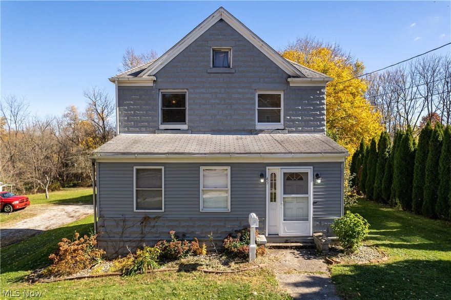 Welcome to 45 31st St, Barberton ~Charming house featuring 3 bedrooms, 1 full bath upstairs, half bath and laundry on main floor, newly remodeled kitchen with built in oven and flat surface electric cooktop '22 built into the island. Spacious living room with fireplace right off the kitchen area and accompanying dining room. New flooring throughout the house that was built for resilience, carpeted stairs, bedrooms with original wood floors and tastefully decorated. Bonus room for additional living space and enclosed porch just waiting for your finishing touch! 2 car garage. Don't miss seeing 45 31st St, Barberton today!!